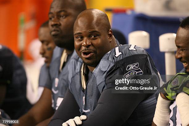 Floyd Womack of the Seattle Seahawks sits on the bench with teammates during the NFL game against the San Francisco 49ers at Qwest Field on November...