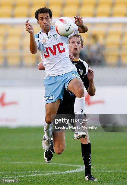 Alex Brosque of Sydney FC heads the ball infront of Steven Old of the Phoenix during the round 13 A-League match between the Wellington Phoenix and...