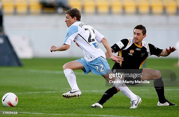 Juninho of Sydney FC is tackled by Michael Ferrante of the Phoenix during the round 13 A-League match between the Wellington Phoenix and Sydney FC at...