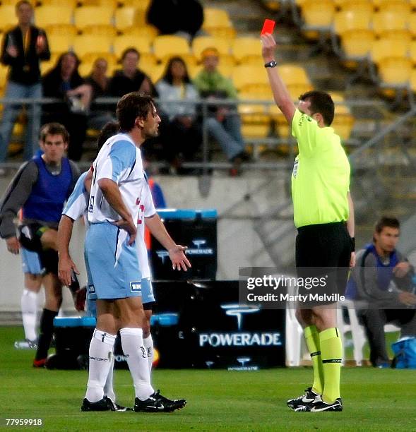 Sydney FC captain Tony Popovic recieves a red card from match referee Peter Green during the round 13 A-League match between the Wellington Phoenix...