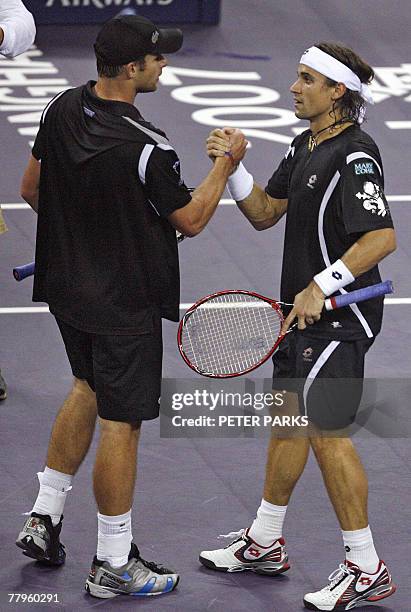David Ferrer of Spain and Andy Roddick of the US shake hands after their 2007 Tennis Masters Cup Shanghai match at the Qizhong Tennis Stadium in...