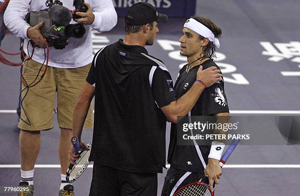 David Ferrer of Spain and Andy Roddick of the US chat after their 2007 Tennis Masters Cup Shanghai match at the Qizhong Tennis Stadium in Shanghai,...