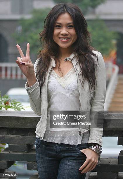 Singaporean singer Tanya Chua attends a fan club activity to promote her new album "Goodbye&Hello" on November 17, 2007 in Nanjing of Jiangsu...