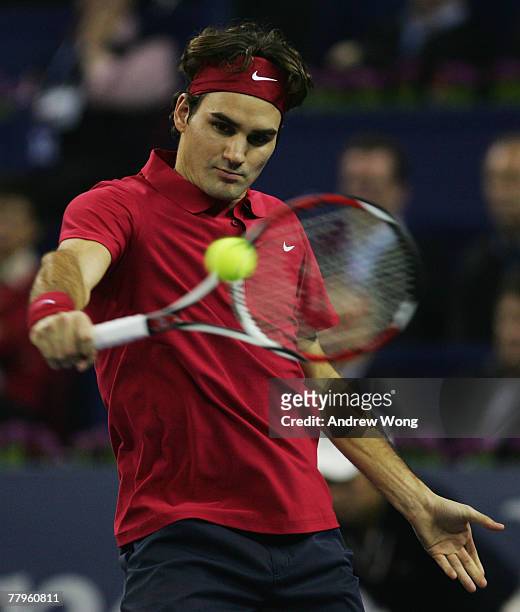 Roger Federer of Switzerland returns a shot against Rafael Nadal of Spain during their semi-final match in the Tennis Masters Cup at Qi Zhong Stadium...