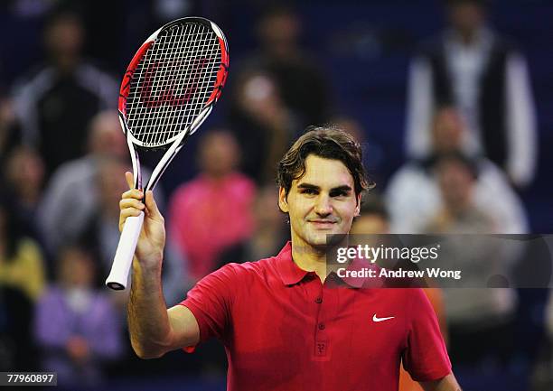 Roger Federer of Switzerland celebrates following his semi-final win over Rafael Nadal of Spain in the Tennis Masters Cup at Qi Zhong Stadium on...