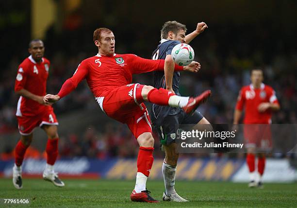 Kevin Doyle of Ireland battles with James Collins of Wales during the Euro2008 Qualifier match between Wales and Republic of Ireland at the...