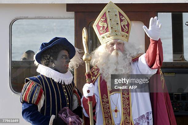 Sinterklaas and his Zwarte Pieten arrive by boat in Antwerp, 17 November 2007. Sinterklaas and his helper Zwarte Piet will bring gifts to children on...