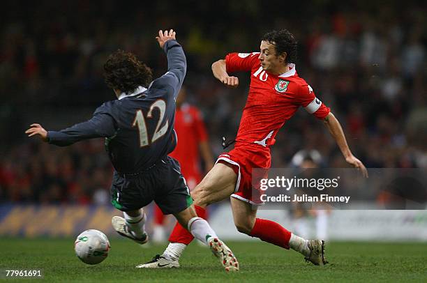 Simon Davies of Wales is closed down by Stephen Hunt of Ireland during the Euro2008 Qualifier match between Wales and Republic of Ireland at the...