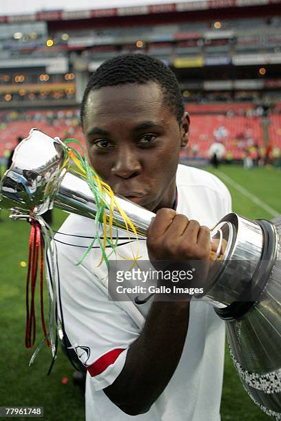 Freddy Adu celebrates with the trophy during the Nelson Mandela Challenge match between South Africa and United States held at Ellis Park Stadium on...