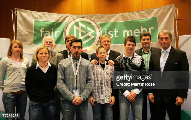 Junior coach of the DFB Horst Hrubesch and DFB vize president Rolf Hocke pose for a picture with the winners of the Fair Play trophy 2007 in...