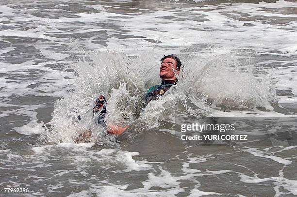 French cyclist Thomas Dietsch, bronze medalist in the Mountainbike World Championship in Verviers, Belgium, celebrates plunging into the sea 17...