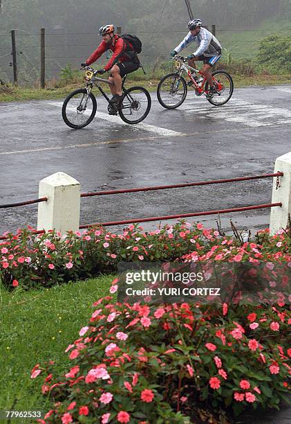 Racers are seen during the last stage of the "Route of Conquerors" mountain bike race 17 November, 2007 in Playa Bonita, Limon province, some 120...