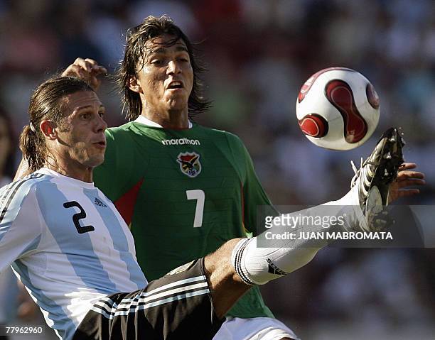 Argentina's defender Martin Demichelis vies for the ball with Bolivia's forward Marcelo Martins during the South American qualifiers for the FIFA...