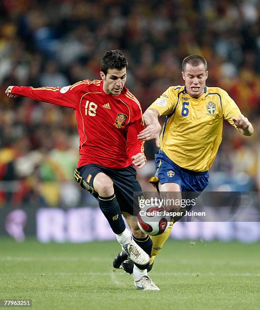 Cesc Fabregas of Spain fights for the ball with Daniel Andersson of Sweden during the Euro 2008 Group F qualifying match between Spain and Sweden at...