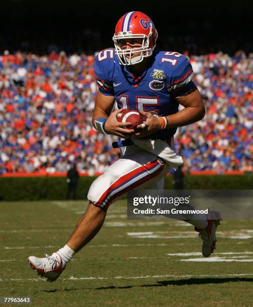 Tim Tebow of the Florida Gators runs for a touchdown during a game against the FAU Owls at Ben Hill Griffin Stadium on November 17, 2007 in...