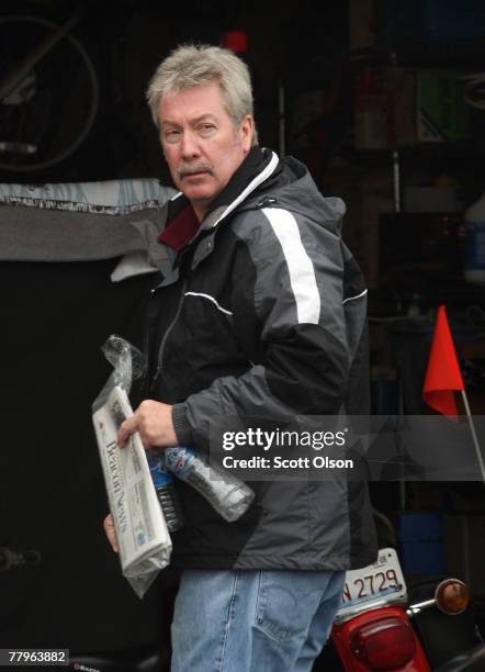 Former Bolingbrook, Illinois police Sgt. Drew Peterson stands in front of the garage at his home November 17, 2007 in Bolingbrook, Illinois. Peterson...