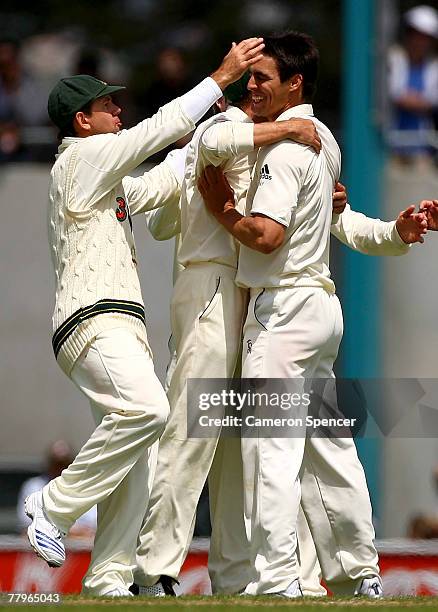Mitchell Johnson of Australia celebrates with team-mates after taking the wicket of Kumar Sangakkara of Sri Lanka during day three of the Second test...