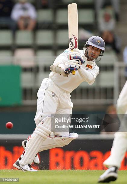 Sri Lankan batsman Kumar Sangakkara flicks a ball to leg from Australian spinner Stuart MacGill on the third day of the second Test Match being...