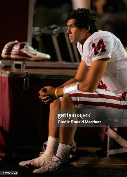 Quarterback Sam Bradford of the Oklahoma Sooners sits on the bench against the Texas Tech Red Raiders in the first quarter at Jones AT&T Stadium on...