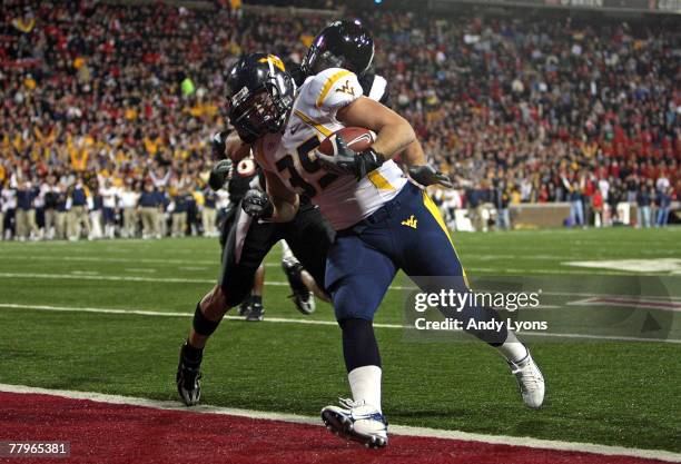 Owen Schmitt of the West Virginia Mountaineers runs for a touchdown during the Big East Conference game against the Cincinnati Bearcats at Nippert...