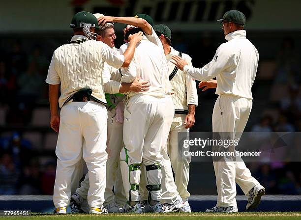 Stuart MacGill of Australia celebrates with Adam Gilchrist after taking the wicket of Chamara Silva during day three of the Second test match between...