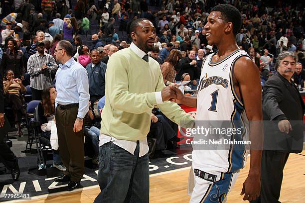 Nick Young and Gilbert Arenas of the Washington Wizards celebrate against the Portland Trailblazers at the Verizon Center November 17, 2007 in...