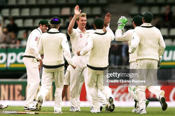 Brett Lee of Australia is congratulated by team-mates after taking a wicket during day three of the Second test match between Australia and Sri Lanka...