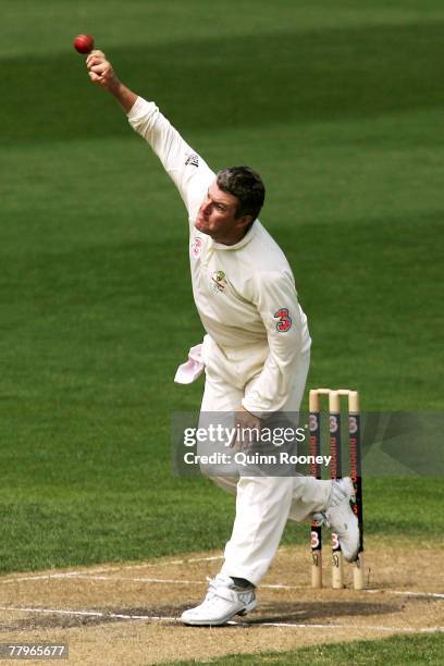 Stuart MacGill of Australia bowls during day three of the Second test match between Australia and Sri Lanka at Bellrevie Oval on November 18, 2007 in...