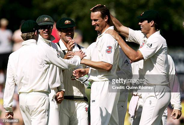 Stuart Clark of Australia is congratulated by team-mates after taking a wicket during day three of the Second test match between Australia and Sri...