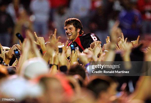 Quarterback Graham Harrell of the Texas Tech Red Raiders celebrates with fans after a 34-27 win against the Oklahoma Sooners at Jones AT&T Stadium on...