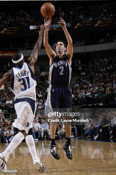 Juan Carlos Navarro of the Memphis Grizzlies shoots over Jason Terry of the Dallas Mavericks at the American Airlines Center November 17, 2007 in...