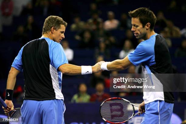 Mark Knowles of Bahamas and Daniel Nestor of Canada celebrate winning a point during their doubles final match against Simon Aspelin of Sweden and...