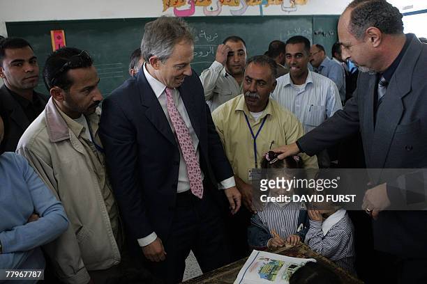 International peace envoy to the Middle East and former British prime minister Tony Blair visits a classroom at an UNRWA elementary school for girls...