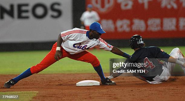 Runner Colby Rasmus is taken out by Cuban second baseman Hector Olivera Amaro during 37th Base World Cup at Tienmu Baseball Stedium in Taipei 18...