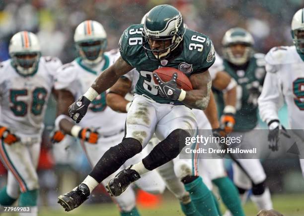 Running back Brian Westbrook of the Philadelphia Eagles hurdles a player while running the ball against the Miami Dolphins on November 18, 2007 at...