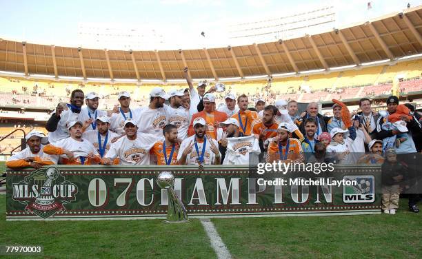 The Houston Dynamo celebrate after defeating the New England Revolution by a score of 2-1 to win the 2007 Major League Soccer Cup at RFK Stadium on...