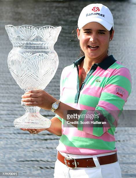 Lorena Ochoa of Mexico celebrates with the trophy after her two-stroke victory at the 2007 ADT Championship at the Trump International Golf Club on...