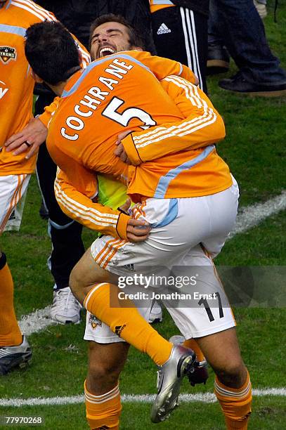 Mike Chabala and Ryan Cochrane of the Houston Dynamo celebrate after defeating the New England Revolution by a score of 2-1 to win the 2007 Major...