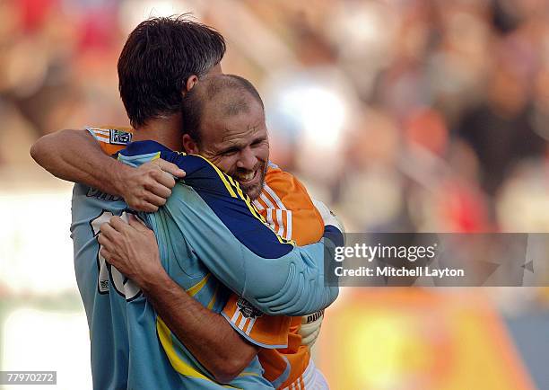 Craig Waibel and Pat Onstad of the Houston Dynamo celebrate after defeating the New England Revolution by a score of 2-1 to win the 2007 Major League...