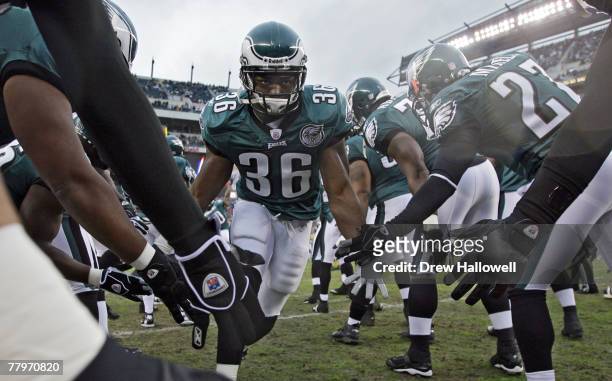 Running back Brian Westbrook of the Philadelphia Eagles gets low-fives from the team while entering the field before the game against the Miami...