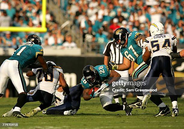 Fred Taylor of the Jacksonville Jaguars runs for a first down against the San Diego Chargers at Jacksonville Municipal Stadium on November 18, 2007...