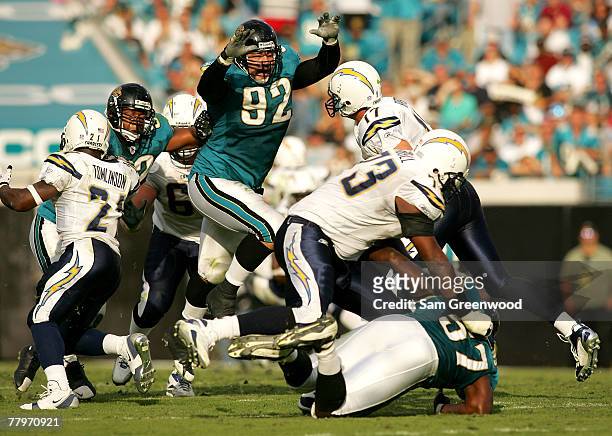Rob Meier of the Jacksonville Jaguars pressures Philip Rivers of the San Diego Chargers at Jacksonville Municipal Stadium on November 18, 2007 in...