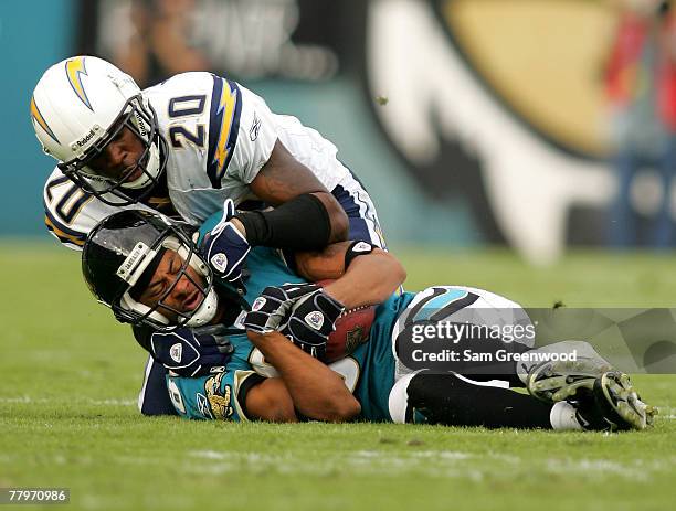 Dennis Northcutt of the Jacksonville Jaguars catches a pass aginst Marlon McCree of the San Diego Chargers at Jacksonville Municipal Stadium on...