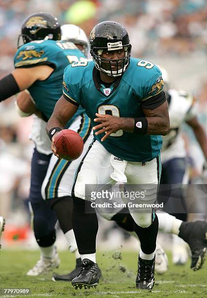 David Garrard of the Jacksonville Jaguars hands off against the San Diego Chargers at Jacksonville Municipal Stadium on November 18, 2007 in...