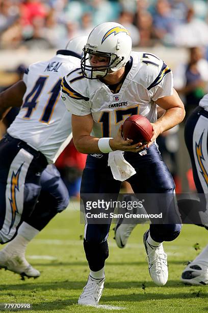 Philip Rivers of the San Diego Chargers hands off against the Jacksonville Jaguars at Jacksonville Municipal Stadium on November 18, 2007 in...