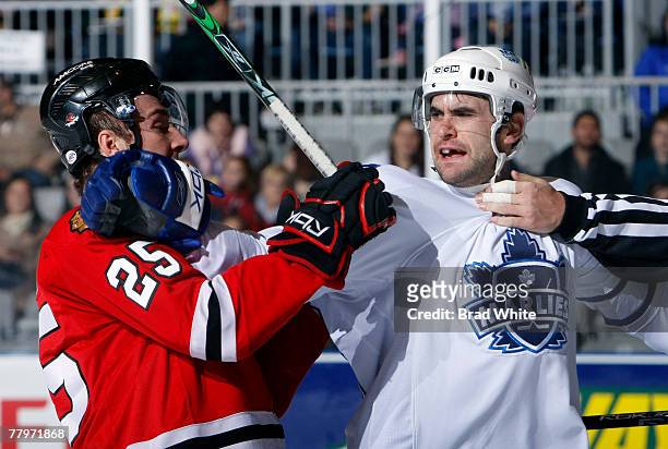 Jay Harrison of the Toronto Marlies gets rough with Cam Barker of the Rockford IceHogs at the Ricoh Coliseum November 18, 2007 in Toronto, Ontario,...