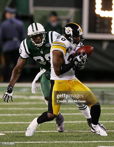 Deshea Townsend of the Pittsburgh Steelers intercepts a pass intended for Jerricho Cotchery of the New York Jets at Giants Stadium November 18, 2007...