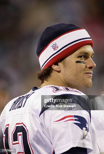 Tom Brady of the New England Patriots stands on the sidelines against the Buffalo Bills at Ralph Wilson Stadium November 18, 2007 in Orchard Park,...