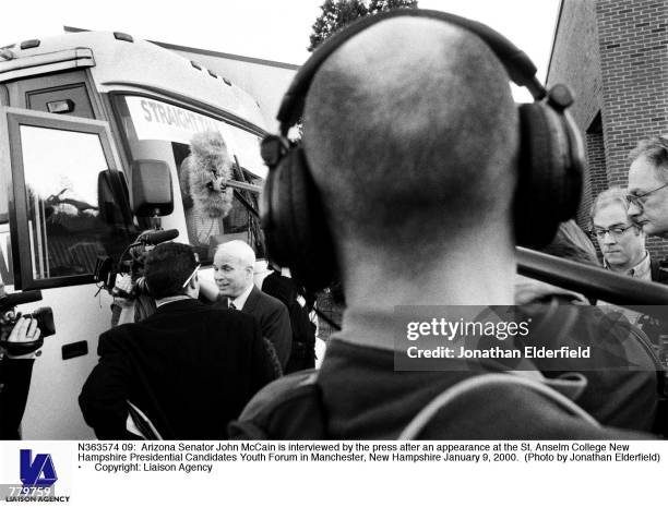 Arizona Senator John McCain is interviewed by the press after an appearance at the St. Anselm College New Hampshire Presidential Candidates Youth...