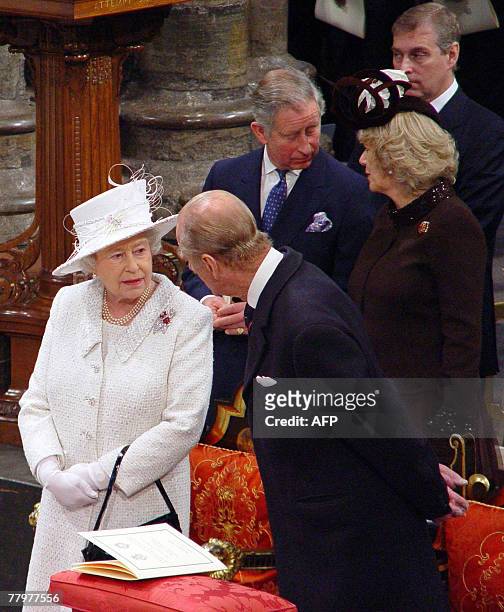 Britain's Queen Elizabeth II and Prince Philip speak in Westminster Abbey, in central London, 19 November 2007, during a service of celebration to...